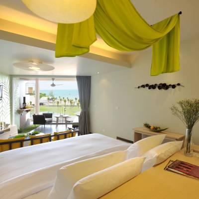 a bedroom with a bed and a mirror