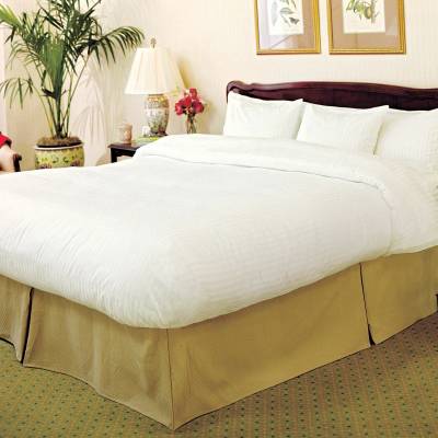 a bedroom with a large bed in a room