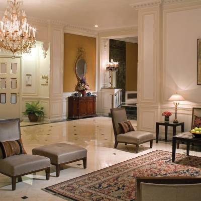 a living room filled with furniture and a fire place
