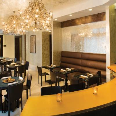 a dining room table in front of a mirror