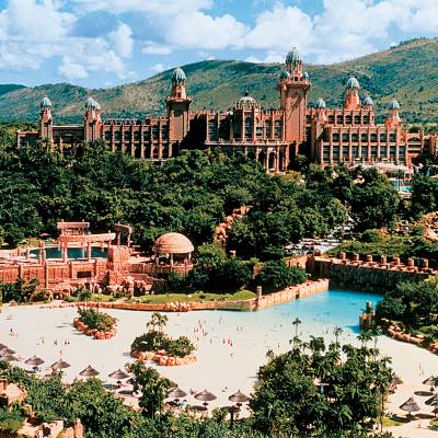 a view of a large building with a mountain in the background
