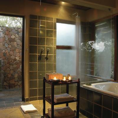 a large white tub next to a window