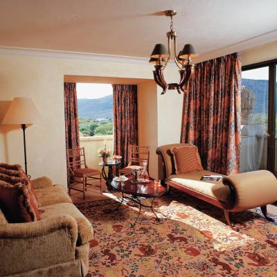 a bedroom with a view of a living room