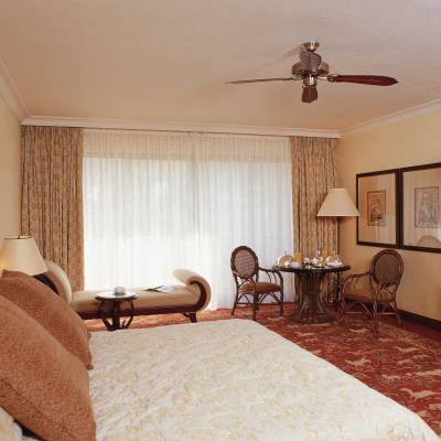 a bedroom with a bed in a room