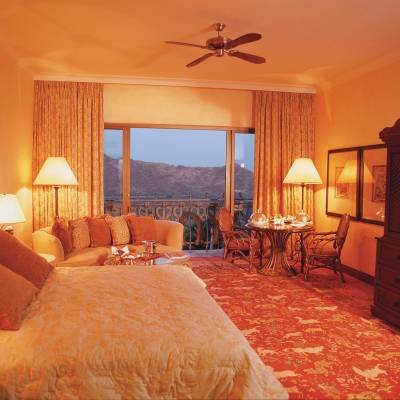 a bedroom with a large bed in a hotel room