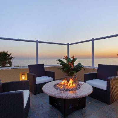 a chair sitting in front of a building