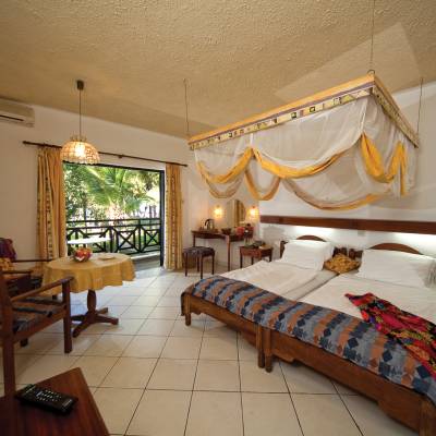 a bedroom with a large bed in a room