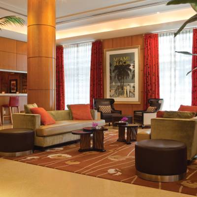 a living room filled with furniture and a large window