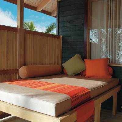 a bedroom with a large bed in a room