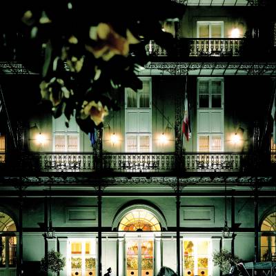 a vase of flowers sits in front of a window