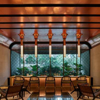 a wooden bench sitting next to a window