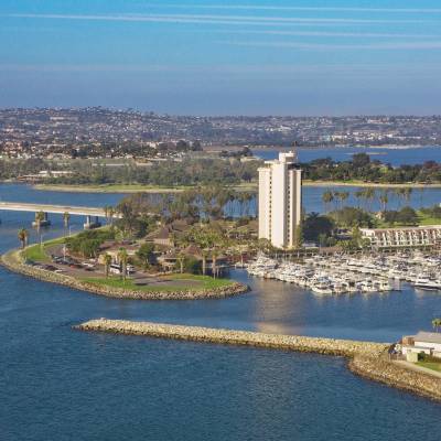 a body of water with a city in the background