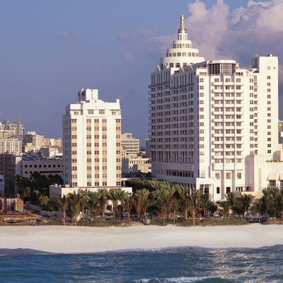 a large body of water with a city in the background