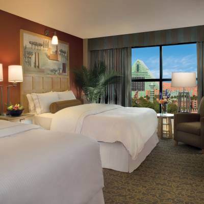 a bedroom with a large bed in a hotel room
