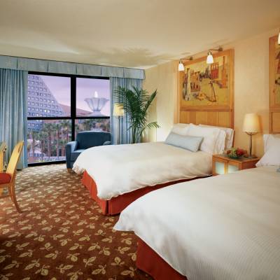 a bedroom with a large bed in a hotel room