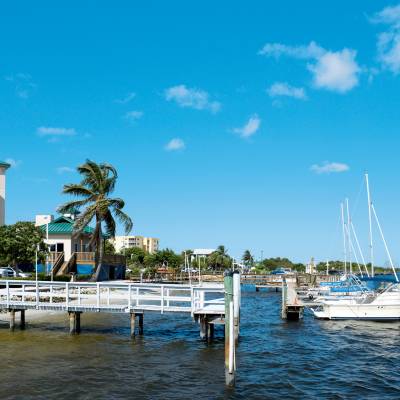 a small boat in a harbor next to a body of water