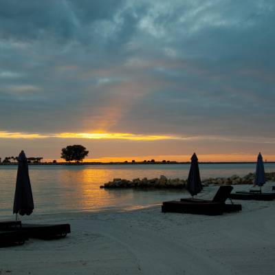 a sunset over a body of water