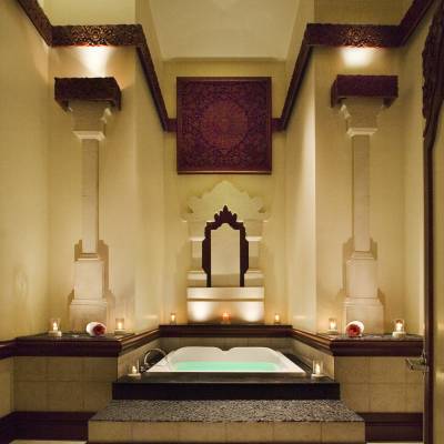 a bedroom with a large mirror