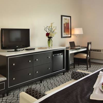 a living room filled with furniture and a flat screen tv