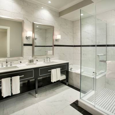 a room with a sink and a mirror