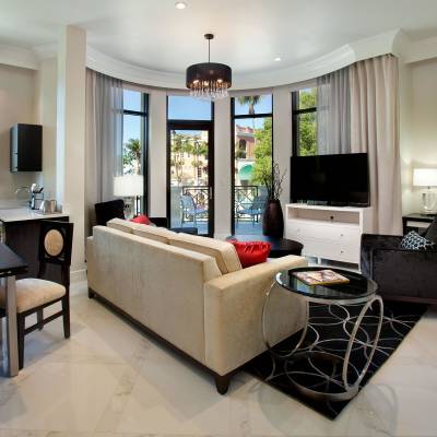 a living room filled with furniture and a large window