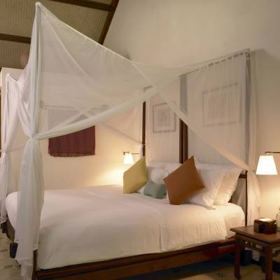 a bedroom with a bed in a room