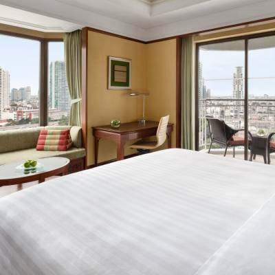 a bedroom with a large bed in a hotel room