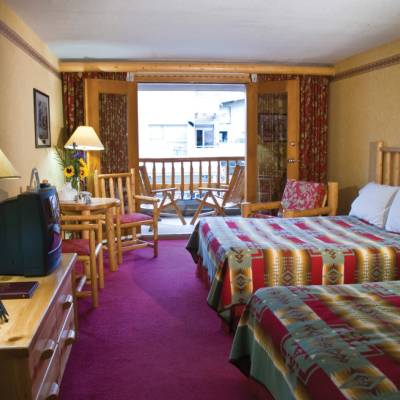 a living room filled with furniture and a bed