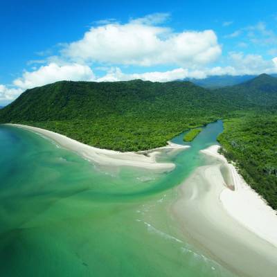 a body of water with Cape Tribulation, Queensland in the background