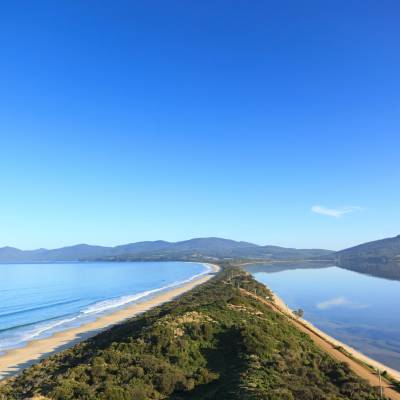 a body of water with a mountain in the background