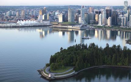 a large body of water with a city in the background