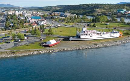 a large body of water with a city in the background