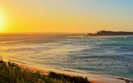 a sunset over a body of water