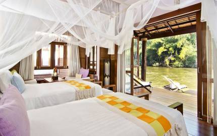 a large white bed in a hotel room