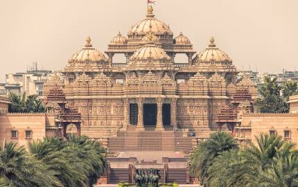 a large building with Akshardham in the background