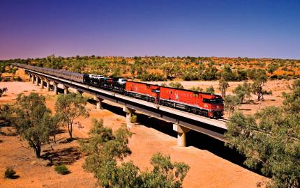 a train crossing a bridge over a river