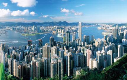 a view of Victoria Peak skyline with a mountain in the background