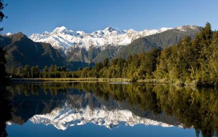 Lake Matheson with a mountain in the background