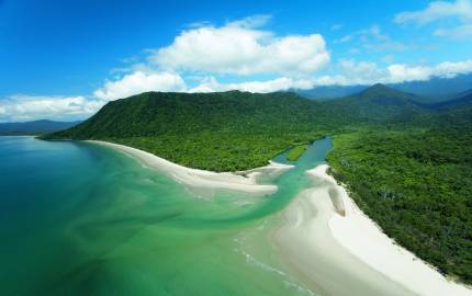 a body of water with Cape Tribulation, Queensland in the background