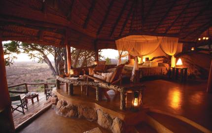 a view of a living room filled with furniture and a bridge