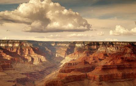 a group of clouds in a canyon