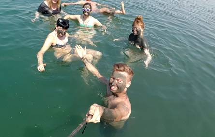 a group of people swimming in a body of water