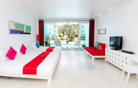 a living room with a red and white furniture