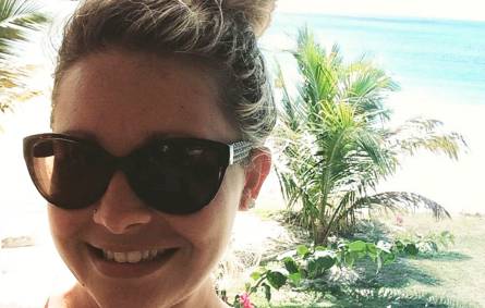 a person wearing sunglasses taking a selfie