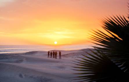 a sunset over a beach
