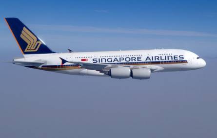 a large passenger jet flying through a blue sky