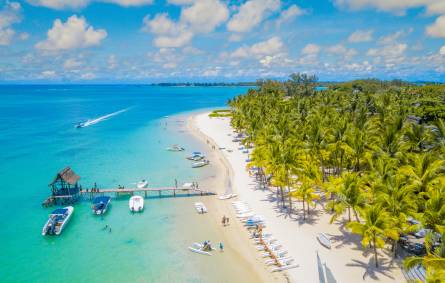 Aerial view of white sand and turquoise waters at Trou aux Biches, Mauritius.