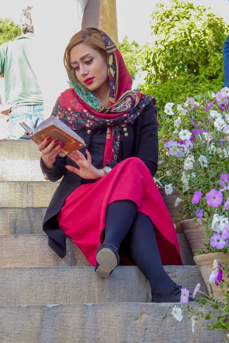Lady reading at the Hafez Mausoleum in Shiraz