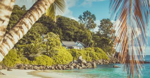 MyPlanet resor - Mahe - Carana Beach Hotel-Beach _ View of some chalets.jpg