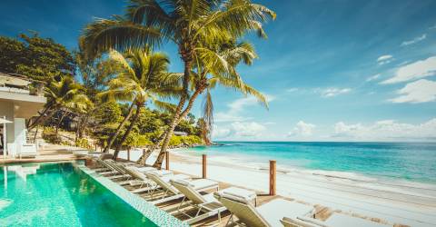 MyPlanet resor-Mahe-Carana Beach Hotel-Loungers, Deck _ Beach.jpg